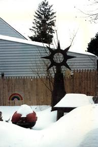 Melded steel sculpture by Dave Fontana, outside his mother’s house after a snow storm